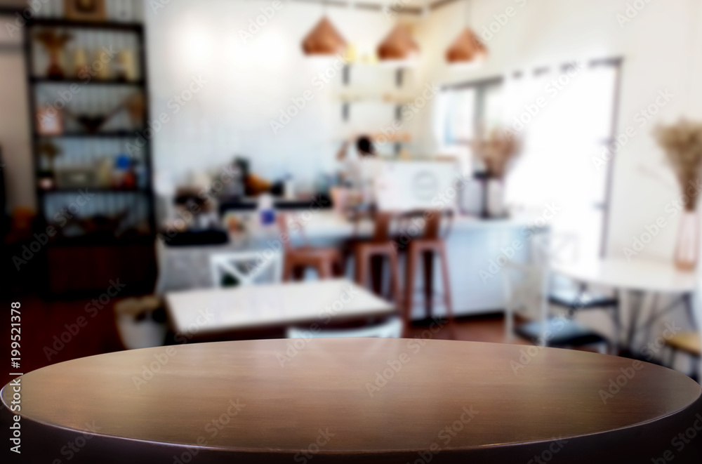 Selected focus empty brown wooden table and Coffee shop or restaurant blur background with bokeh image. for your photomontage or product display. Selected focus empty brown wooden table and Coffee shop or restaurant blur background with bokeh image. for your photomontage or product display.
