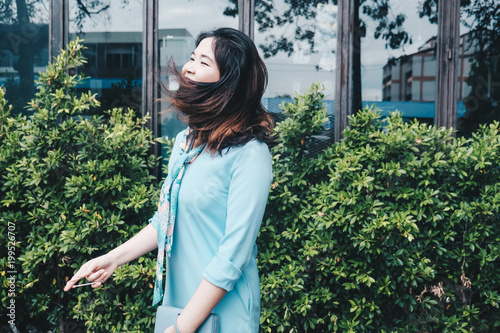 Asian beautiful young women relaxing on green plant background Free Download Asian beautiful young women relaxing on green plant background - GFXLoad