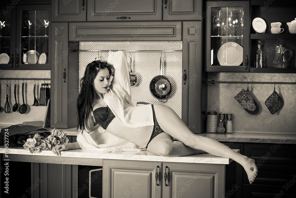 Attractive sexy european woman on a modern kitchen wear lingerie and  feeling good, vintage style and modern element in interior Stock Photo |  Adobe Stock