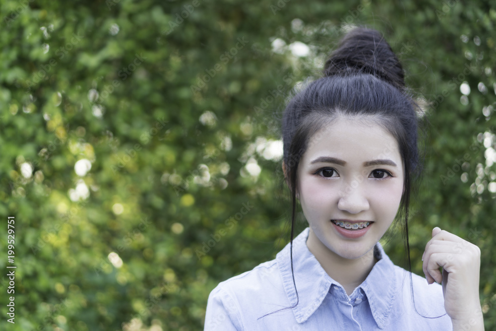 Asian girl Wrought Iron With a charming smile.And beautiful eyes. Portrait Photography.ดวงตา Asian girl Wrought Iron With a charming smile.And beautiful eyes. Portrait Photography.ดวงตา