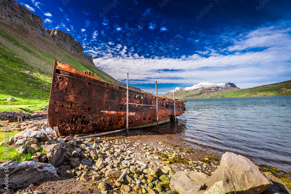 Rusty shipwreck on the Arctic sea, Iceland