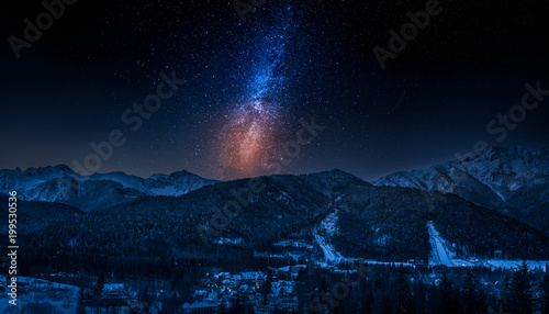 Zakopane in winter at night with milky way, Tatras mountains