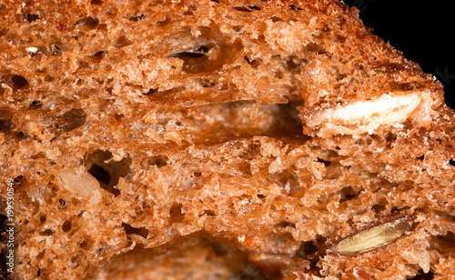 Bread with seeds and raisins as a background