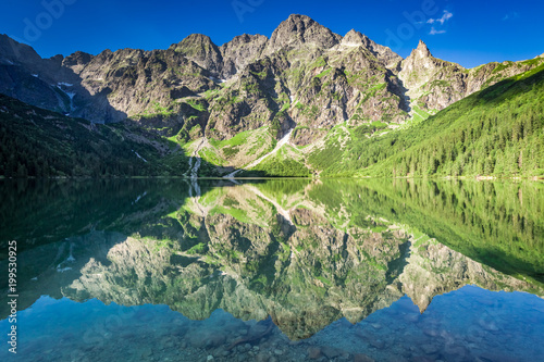 Fototapeta Naklejka Na Ścianę i Meble -  Stunning sunrise at lake in the Tatra Mountains, Poland