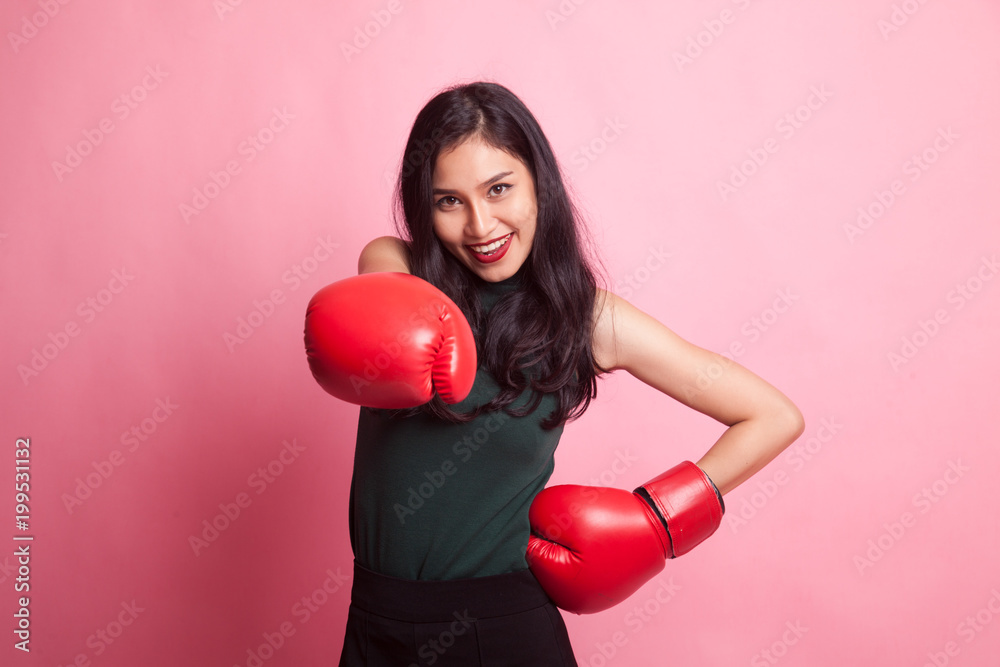 Young Asian woman with red boxing gloves. Young Asian woman with red boxing gloves.