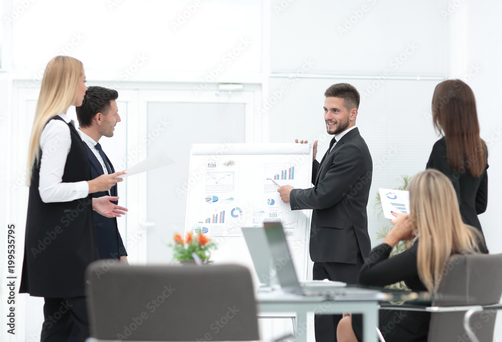 businessman makes a presentation to his business team businessman makes a presentation to his business team