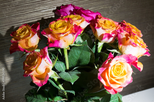 Fototapeta Naklejka Na Ścianę i Meble -  Festive bouquet of fresh roses with original yellow and crimson coloration.