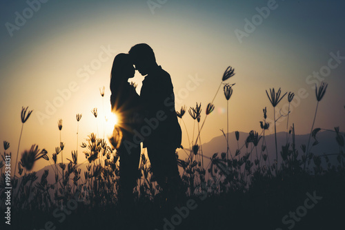 Canvastavla silhouette of Couple in love silhouette during sunset