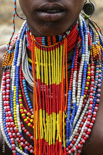 Close-up of a woman from the Arbore tribe with traditional jewelry, Omo valley, Ethiopia. photo