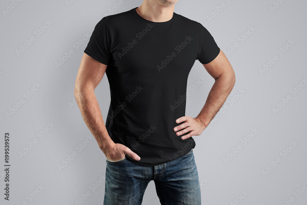 Front Mockup black shirt on a guy for an example design. Front Mockup black shirt on a guy for an example design.