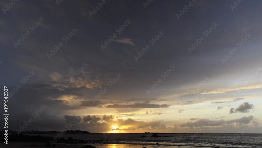 Sunset in a cloudy and rainy sky over the sea in time-lapse. View of a seahore from a European beach. 4K UHD. Sunset in a cloudy and rainy sky over the sea in time-lapse. View of a seahore from a European beach. 4K UHD.