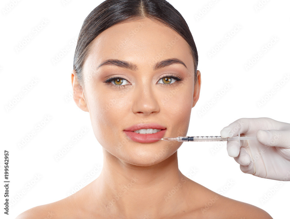 Portrait of an attractive young woman receiving botox treatment.