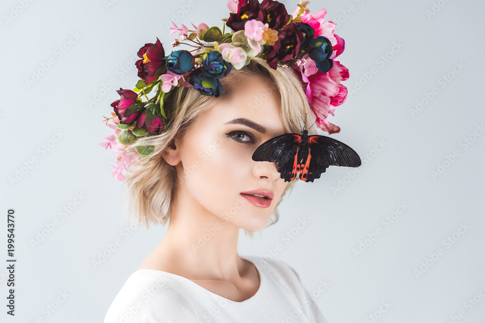 Woman with floral wreath and butterfly