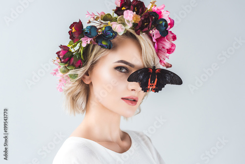 Woman with floral wreath and butterfly