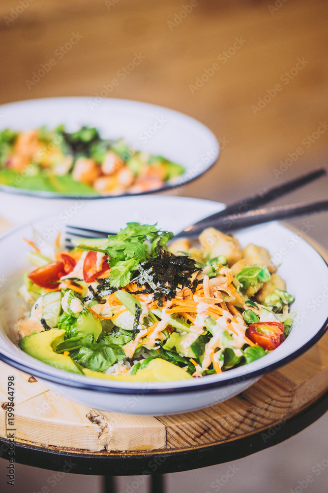 Green Goddess Buddha Bowl on wooden table. Healthy eating, food photography concept. Copy space, vertical Green Goddess Buddha Bowl on wooden table. Healthy eating, food photography concept. Copy space, vertical