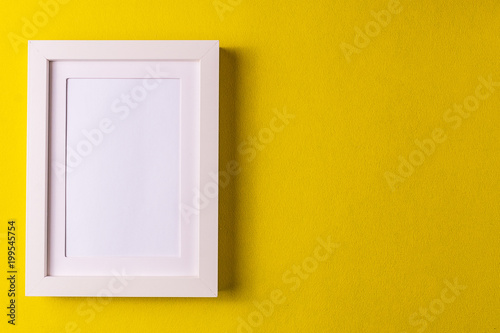 Abstract minimalism colofrul paper background with empty picture frame.;