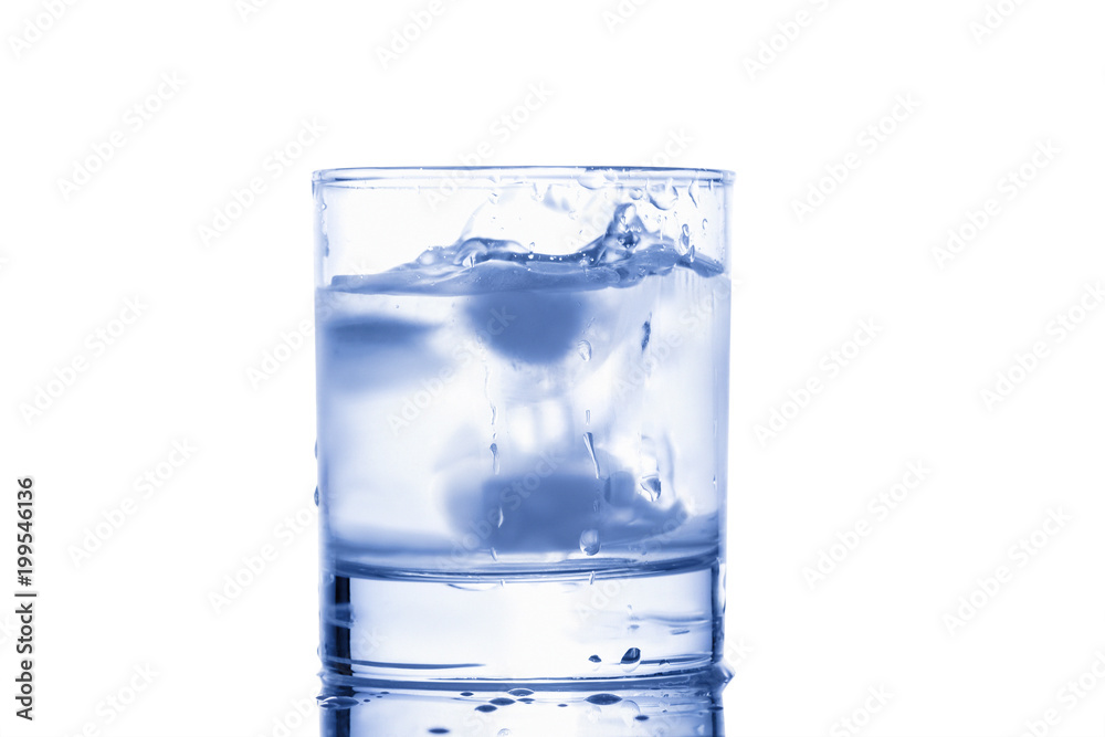 blue water splashing out of a glass with drops blue water splashing out of a glass with drops