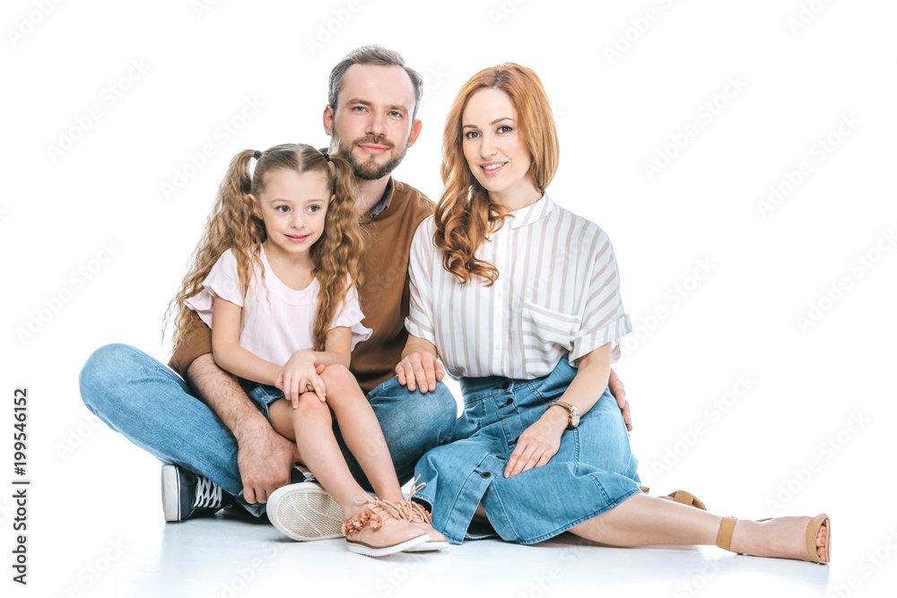 happy family with one child sitting together and smiling at camera isolated on white happy family with one child sitting together and smiling at camera isolated on white