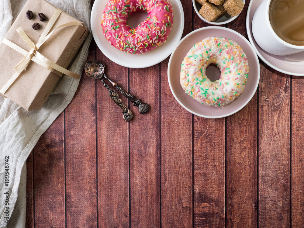 Donuts and coffee on wooden table. Top view with copy space Donuts and coffee on wooden table. Top view with copy space