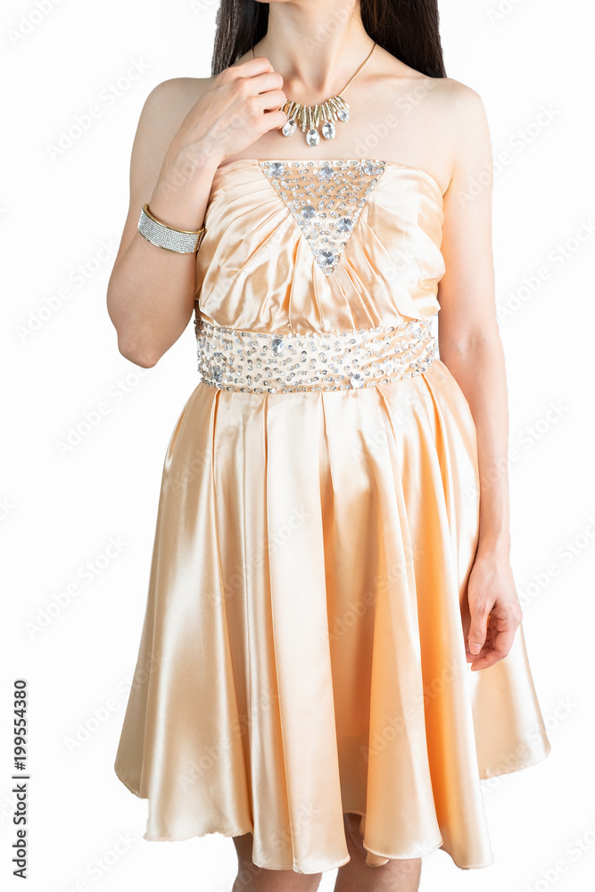 Young woman in gold elegant woman dress with silver and golden