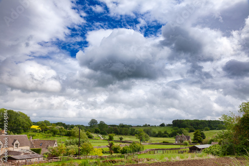 English rural landscape with dramatic sky over small village Southern England UK