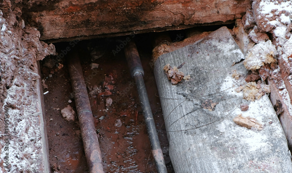 custom made wallpaper toronto digitalCrash, burst pipes and leaking water under the earth. Excavated pipes in the winter.