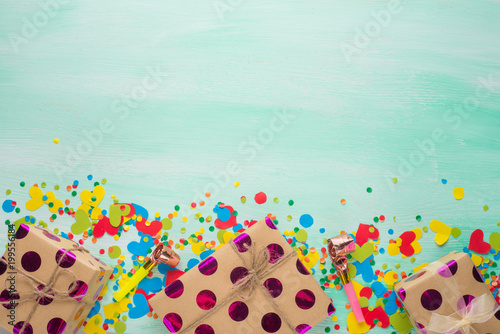 Gifts with confetti for the holiday. Top view with an empty place for inscription or advertising.