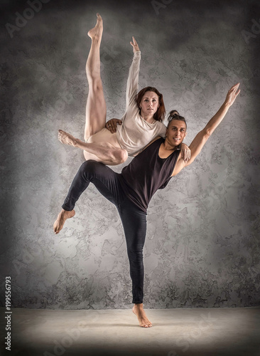 Fototapeta Naklejka Na Ścianę i Meble -  Two person, dancers, woman and man in dynamic action figure pose