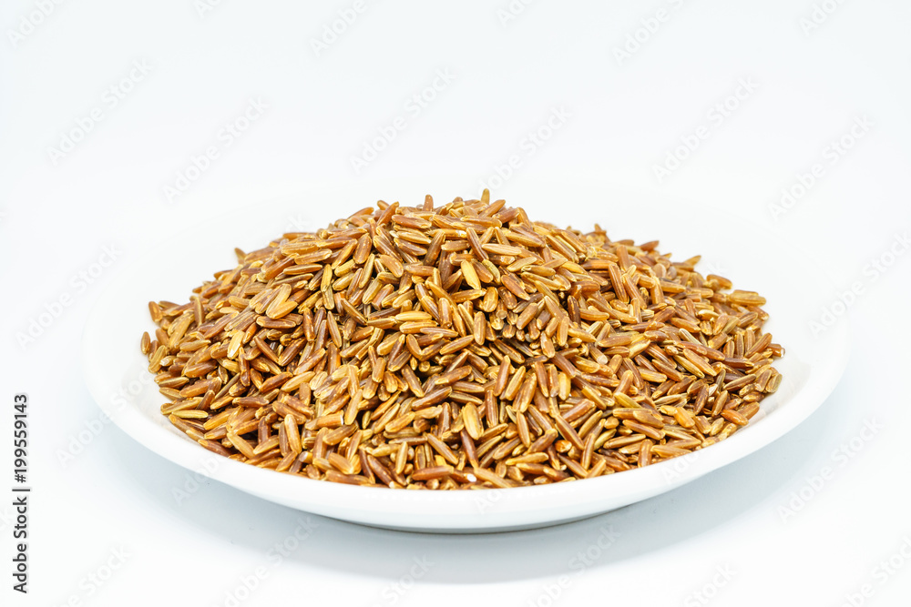 Brown rice white isolated. The whole grain rice, the inedible outer hull removed; white rice is the same, bran layer and cereal germ removed. Red rice, gold rice, and black rice are all whole rices Brown rice white isolated. The whole grain rice, the inedible outer hull removed; white rice is the same, bran layer and cereal germ removed. Red rice, gold rice, and black rice are all whole rices