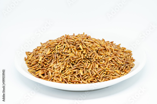 Brown rice white isolated. The whole grain rice, the inedible outer hull removed; white rice is the same, bran layer and cereal germ removed. Red rice, gold rice, and black rice are all whole rices