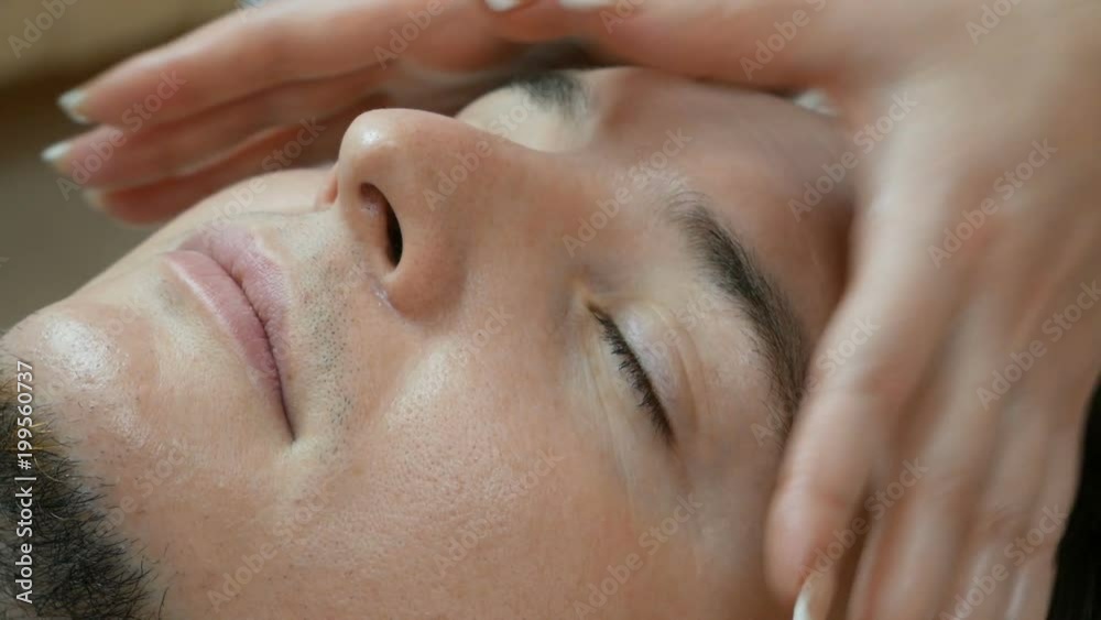 Man getting a face massage in beauty salon. cosmetologist concept. Man getting a face massage in beauty salon. cosmetologist concept.