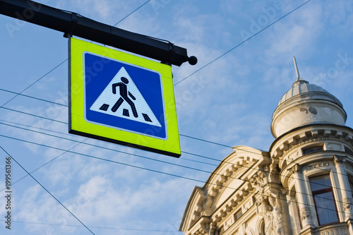 Pedestrian srosswalk sign on city street. Crosswalk. Urban traffic. Saint Petersburg, Russia.