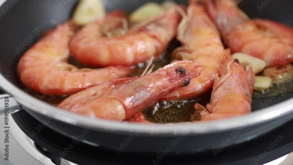 frying shrimps on frying pan frying shrimps on frying pan