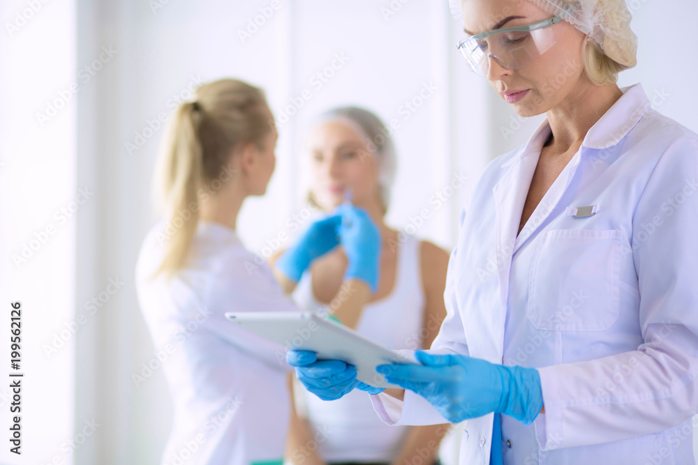 Beautiful woman face near doctor with syringe. Beautiful woman face near doctor with syringe.