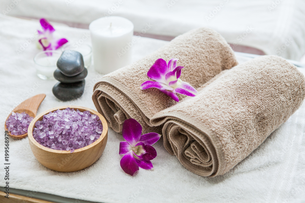 Beautiful spa composition treatment setting orchid, towels, bath salts ,candle,stone Beautiful spa composition treatment setting orchid, towels, bath salts ,candle,stone