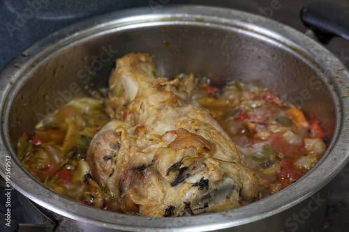 Pork knuckle cooked with vegetables