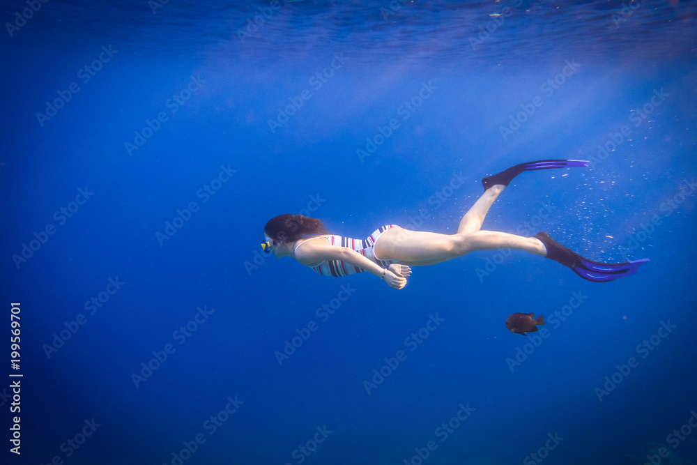 Girl dive in Red sea with wish
