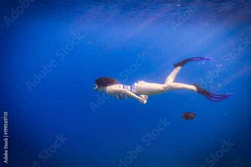 Girl dive in Red sea with wish