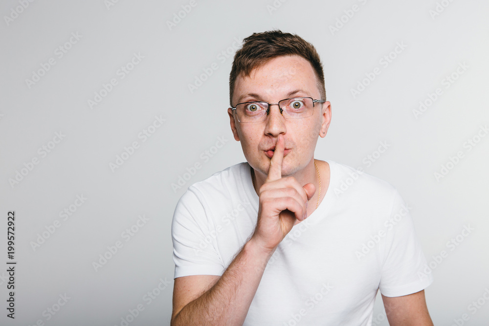 Man put finger on her lips. Sign of silence. Man put finger on her lips. Sign of silence.