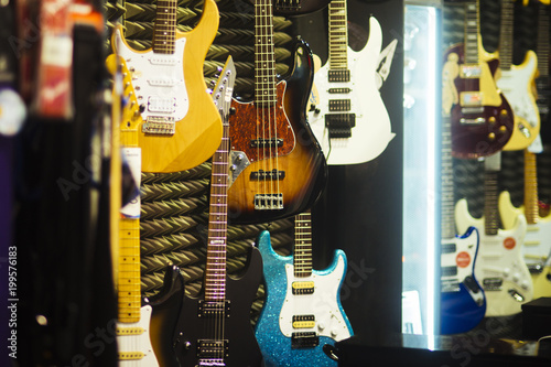 Fotografie, Obraz Guitars of different colours in music store.