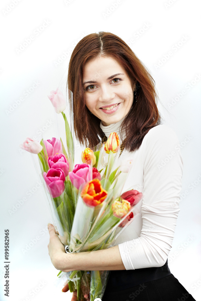 Beautiful girl with a Bouquet of Tulip flowers. Isolated on a white background. Beautiful girl with a Bouquet of Tulip flowers. Isolated on a white background.
