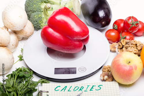 Weigh products on electronic kitchen scales and record the results. The concept of healthy eating, diet, calorie counting, eating restrictions