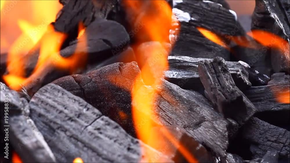 Lumpwood charcoal burning on a barbecue Lumpwood charcoal burning on a barbecue