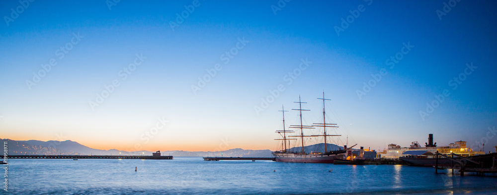 A Large Sail Ship in Harbor at Sunset, in San Francisco, California