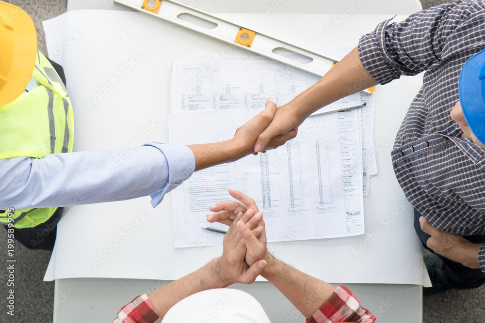 Successful Deal, Engineer / Contractor Shaking Hands With Client In  Construction Site After Confirm Blueprint For Renovate Building. Stock  Photo | Adobe Stock