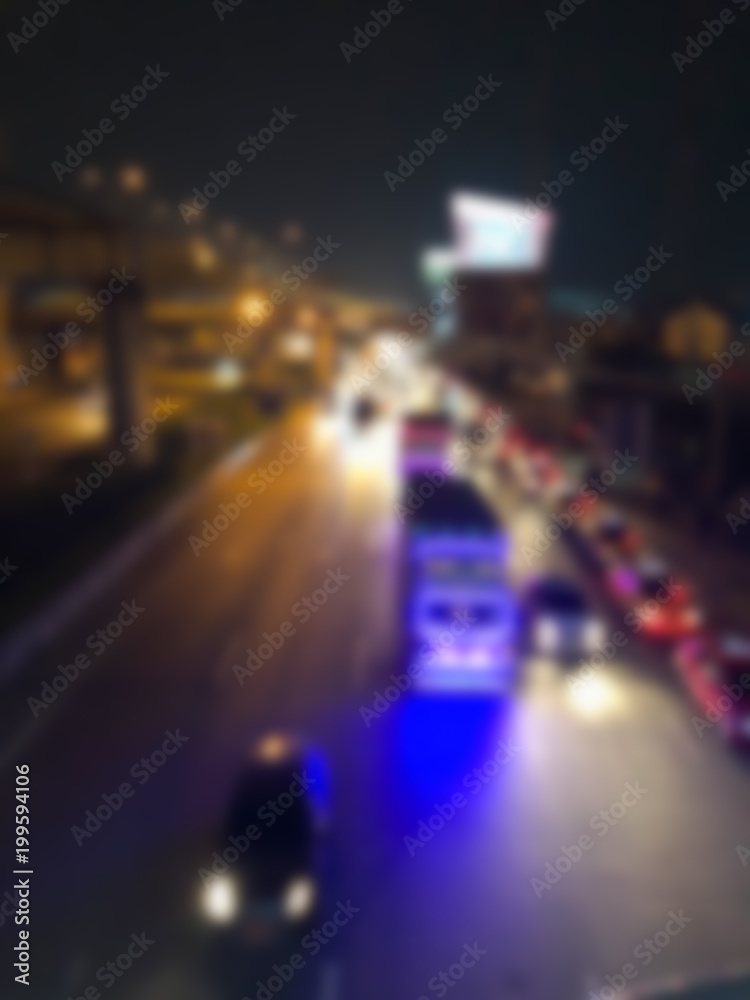 Blurred of cars on road in night time.