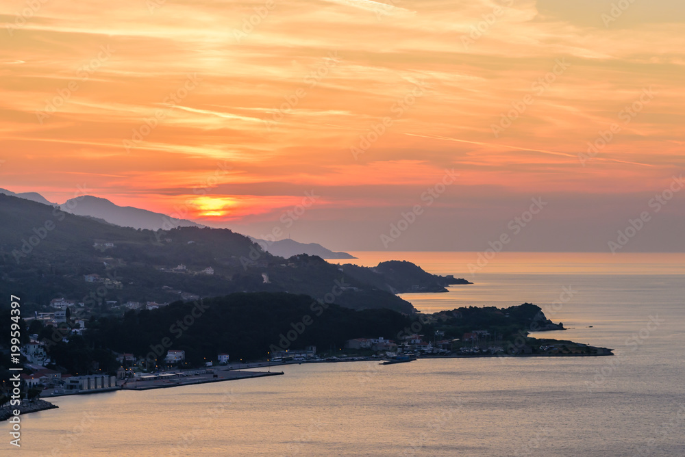 Beautiful sunset on the sea. The coastline of the island of Samos in the time of sunset, Samos island, Greece