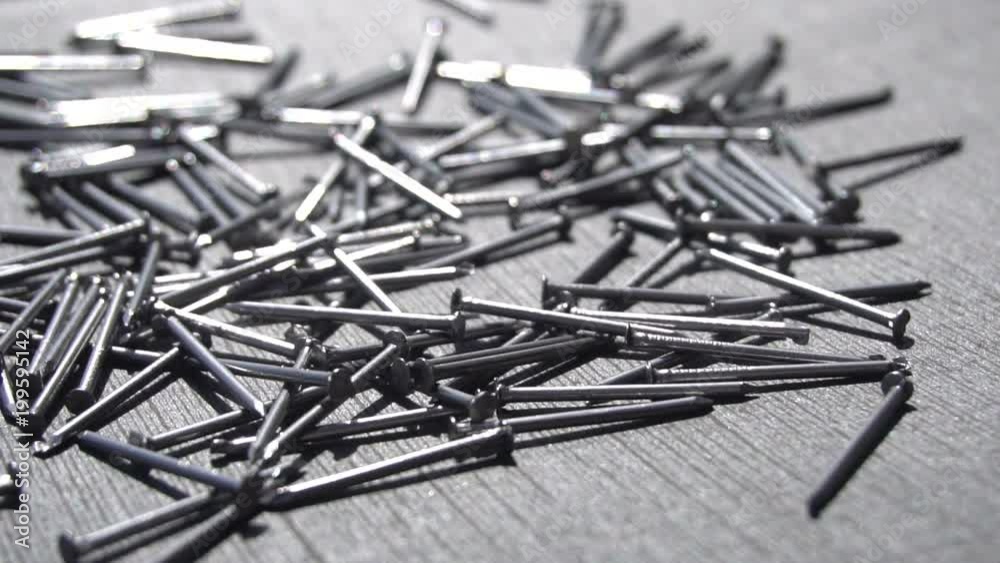 Falling metal nails slow motion 