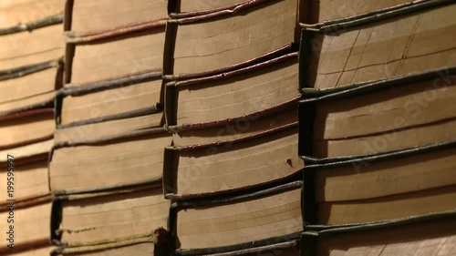 Dolly motion on a shelf of old books
