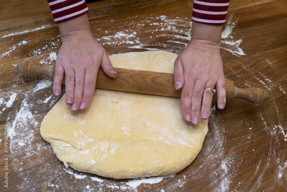 Women's hands prepare a donut dough Women's hands prepare a donut dough